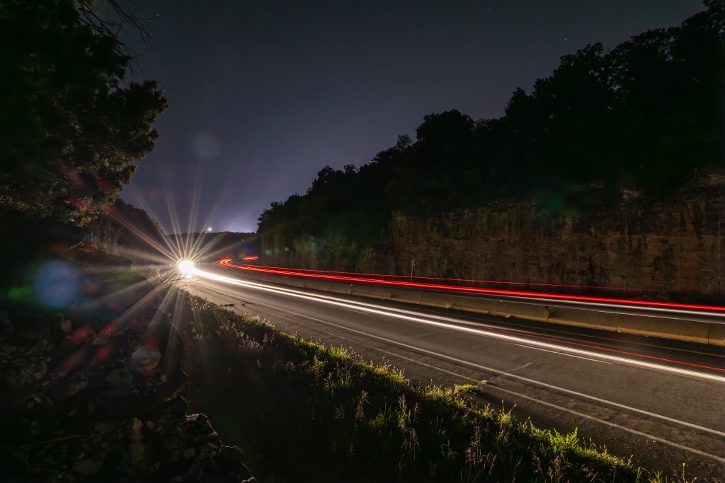 Cars driving on Stadium Boulevard at night.