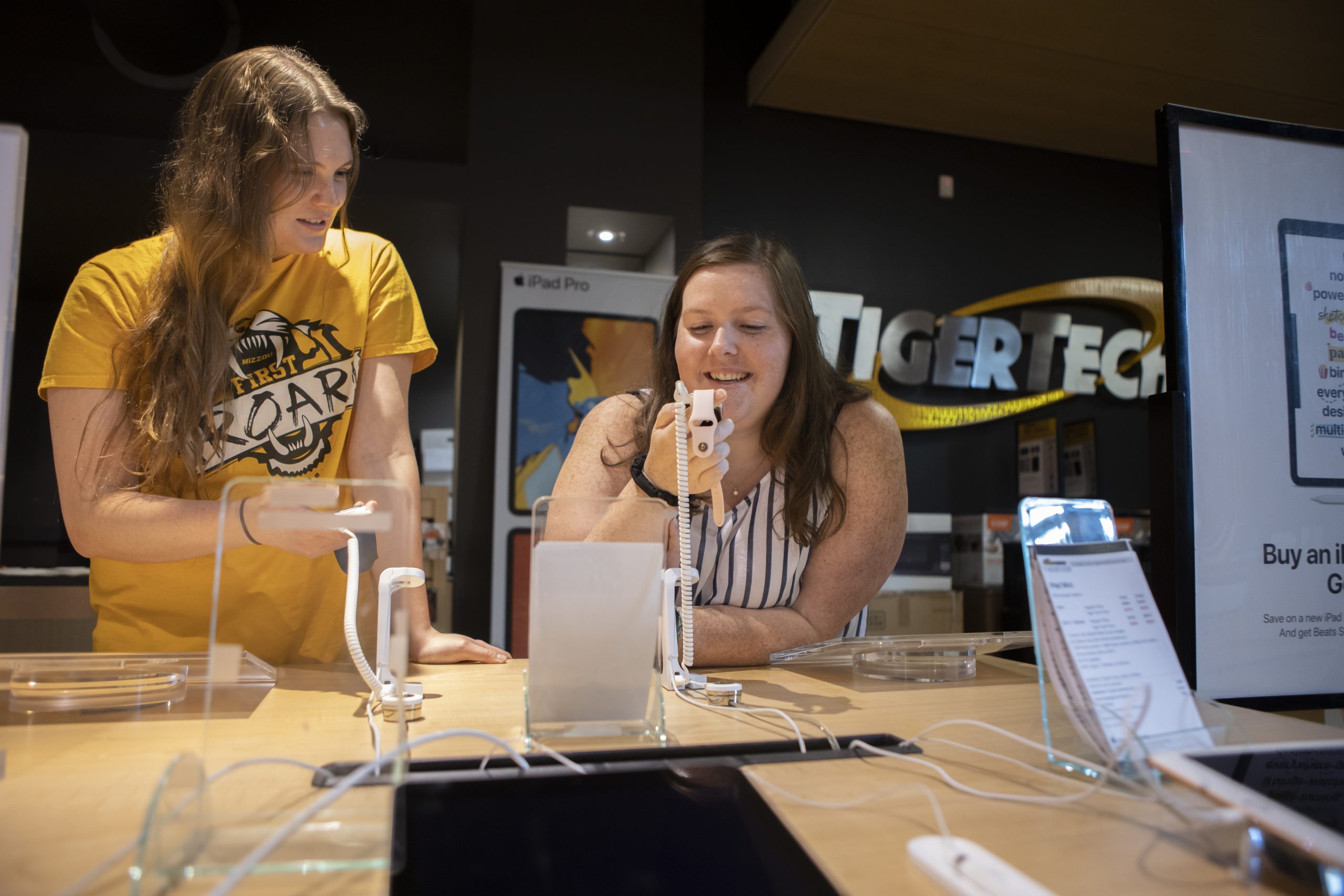 Two students look at devices in TigerTech in The Mizzou Store