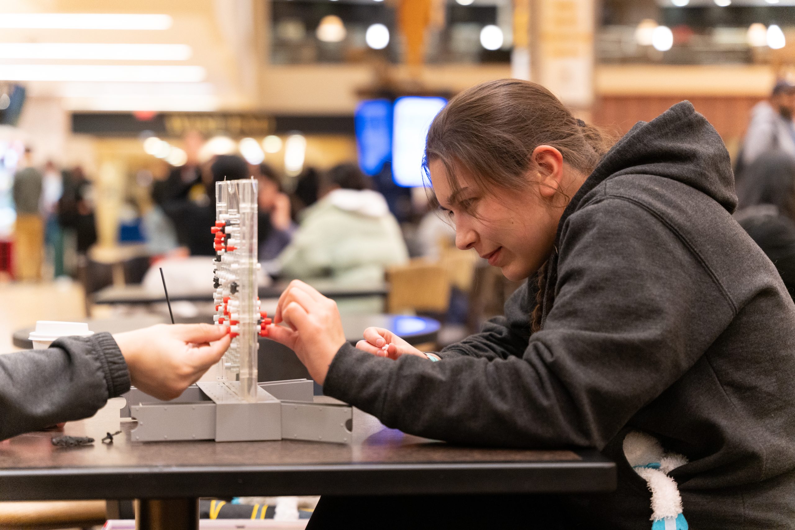 Two students play a game of break the ice