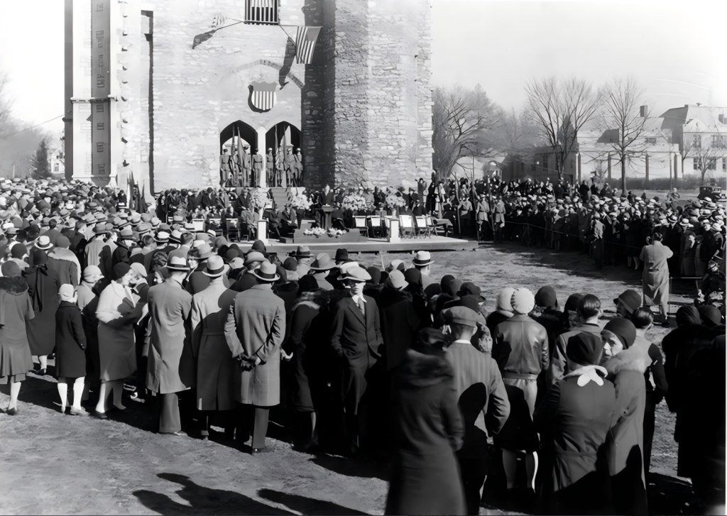People standing outside the Memorial Student Union Tower during its dedication ceremony in 1926