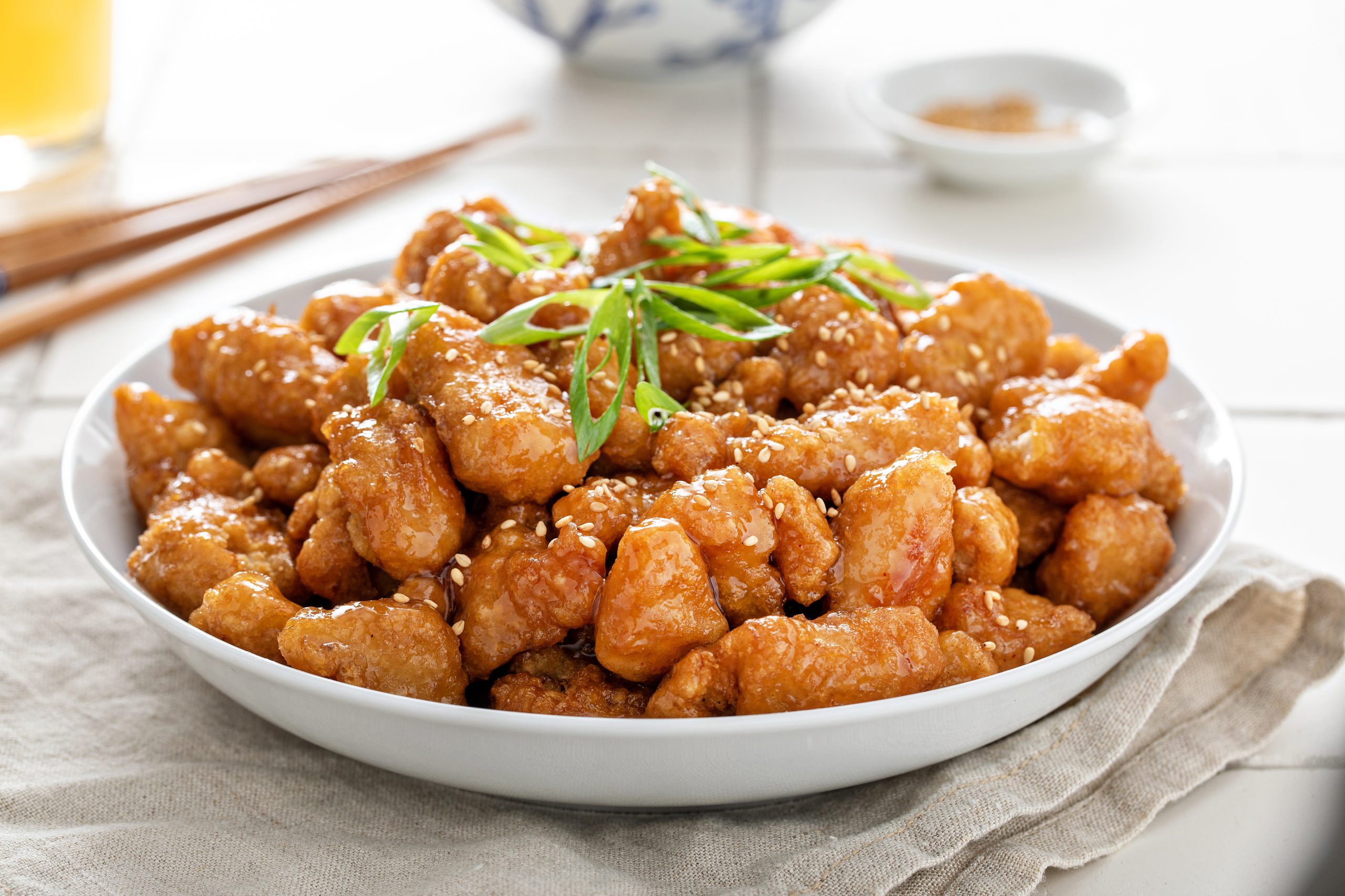 A bowl of orange chicken