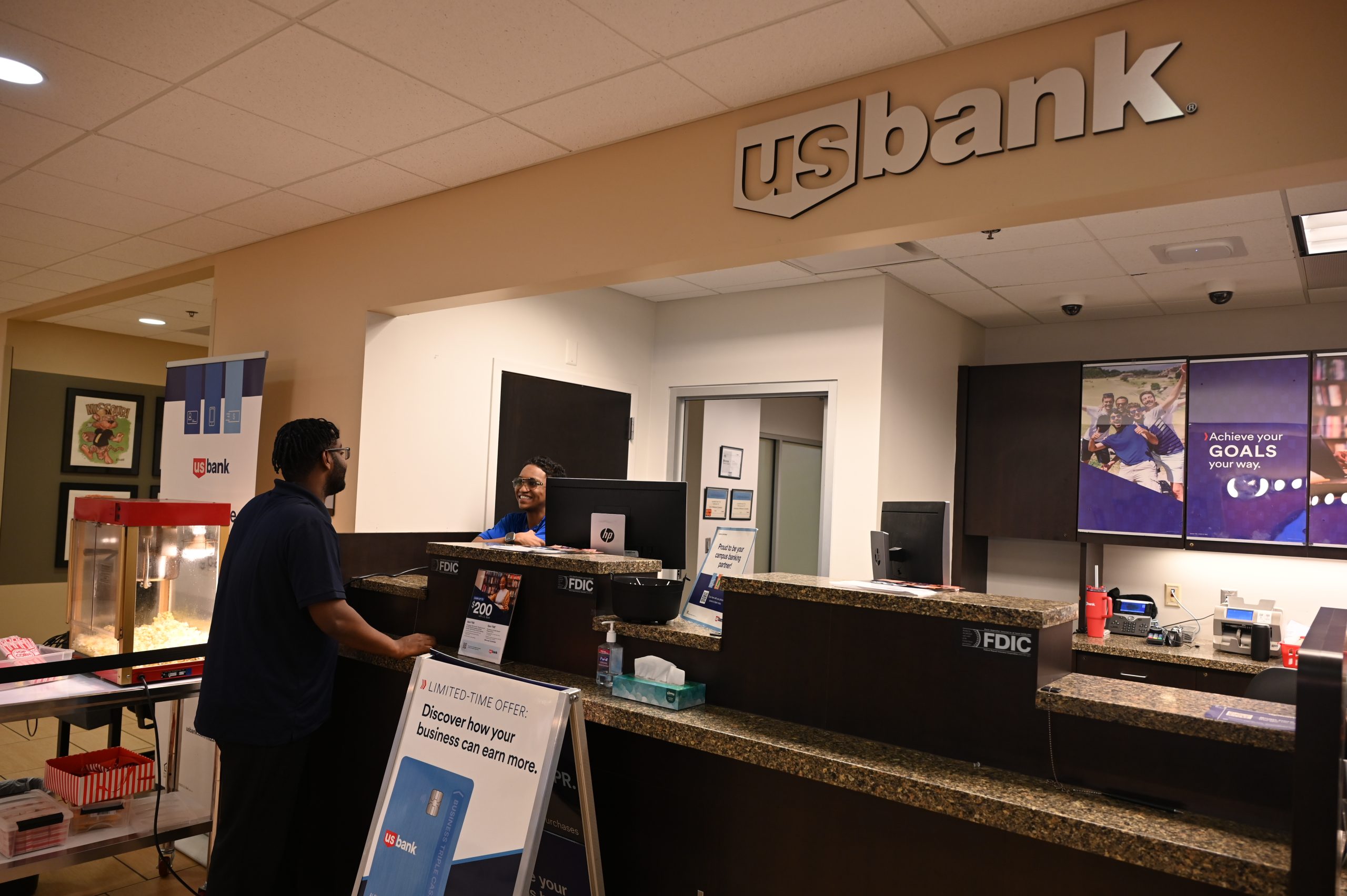 A student asks for help at the U.S. Bank location in the MU Student Center