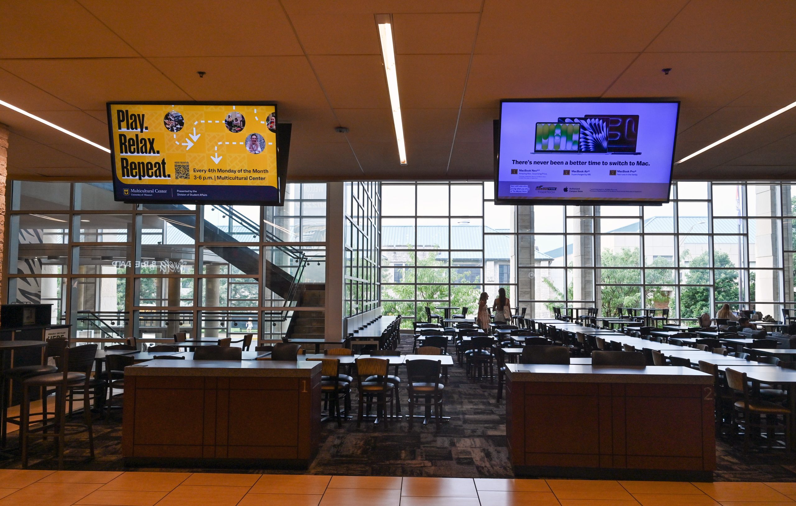 TV screens hang from the ceiling in the MU Student Center